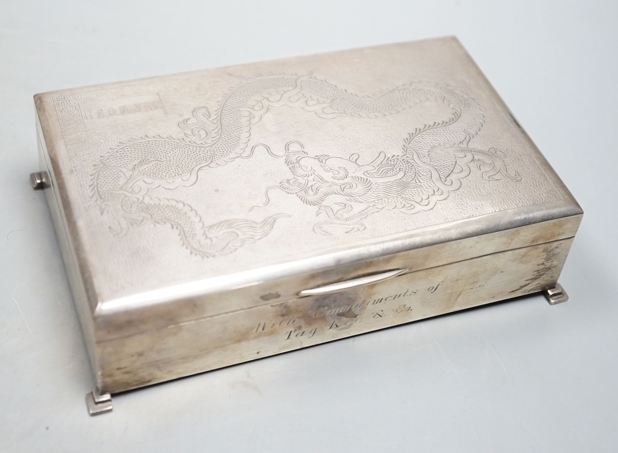 A Chinese Export sterling mounted cigarette box, Lee Yee Hing, engraved with dragon, 17.3cm, gross 18.5oz.